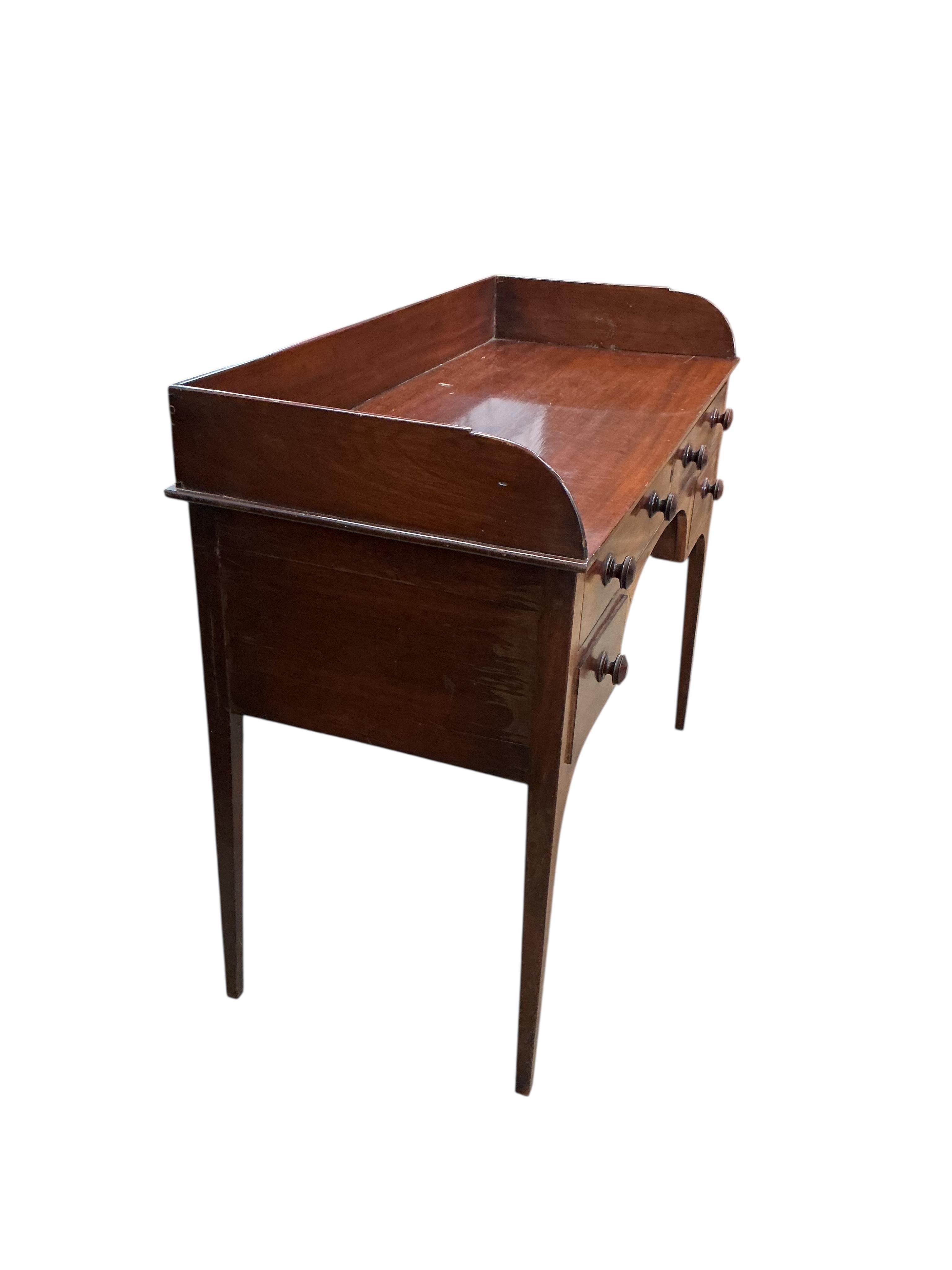A George III mahogany washstand, width 106cm, depth 48cm, height 88cm